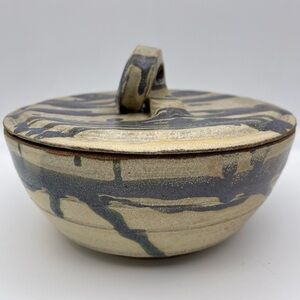 Handmade artist signed stoneware bakeware with matching lid.